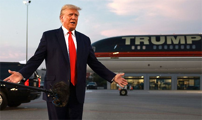 president Trump and his aircraft in the background