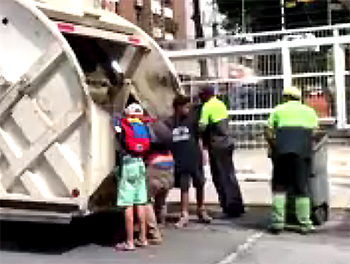 Venezuelans search through trash truck for food