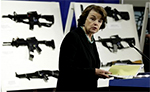 Liberal Democrat Feinstein of California stands infront of Guns in the Capitol